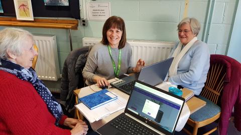 Three people at a Computers and a Cuppa session.