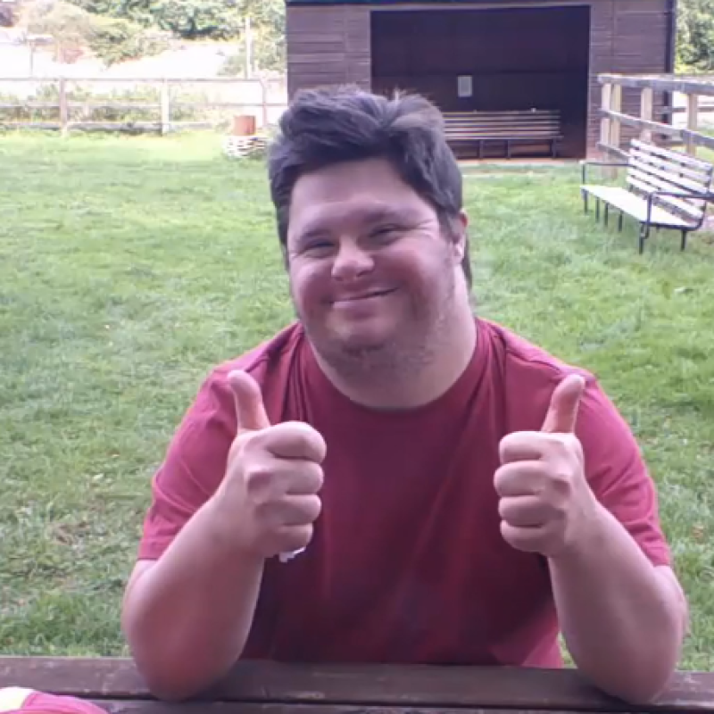 Jack with his thumbs up and smiling. 