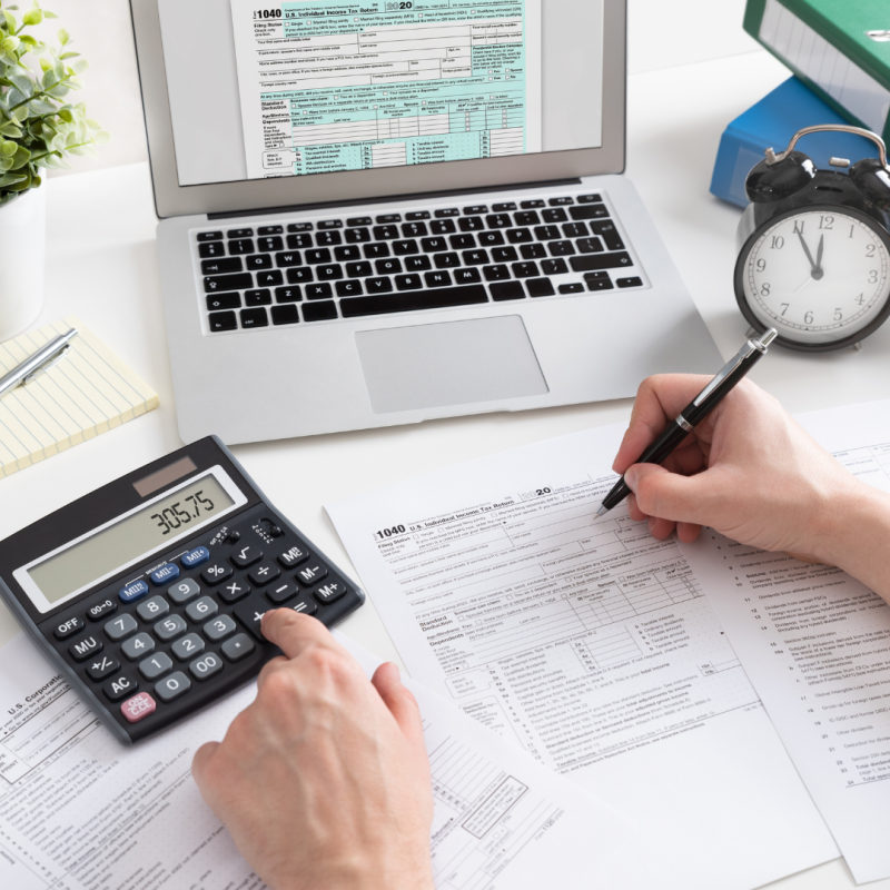 Paper, calculator, laptop, clock