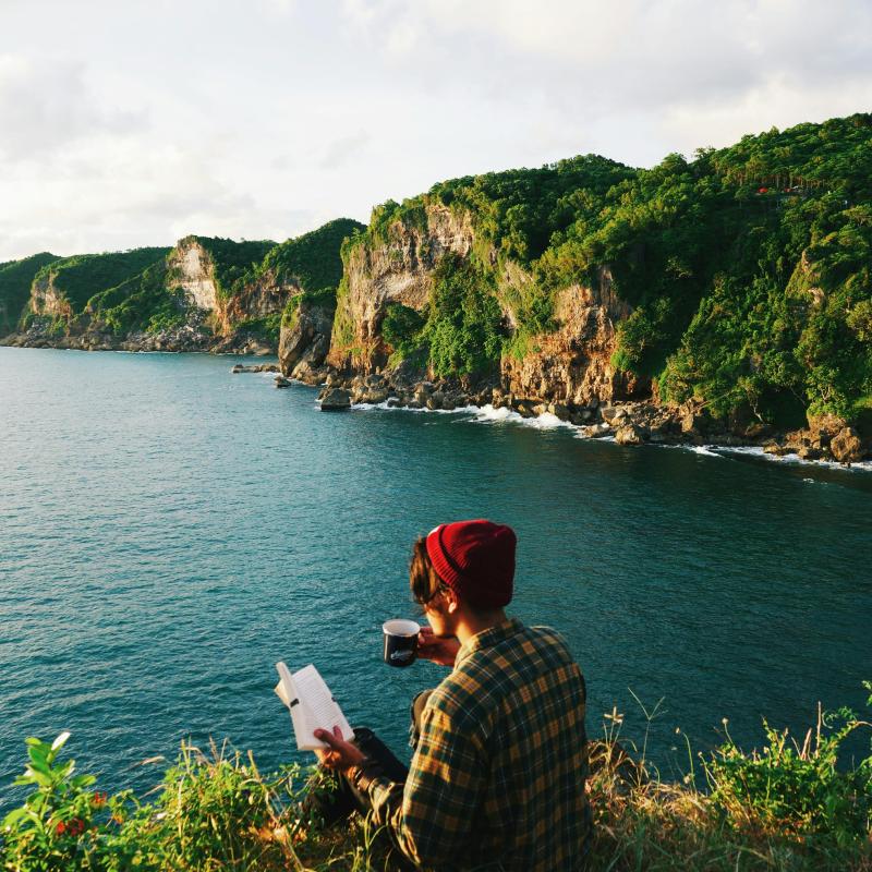 https://www.pexels.com/photo/photo-of-person-sitting-on-cliff-edge-3224344/