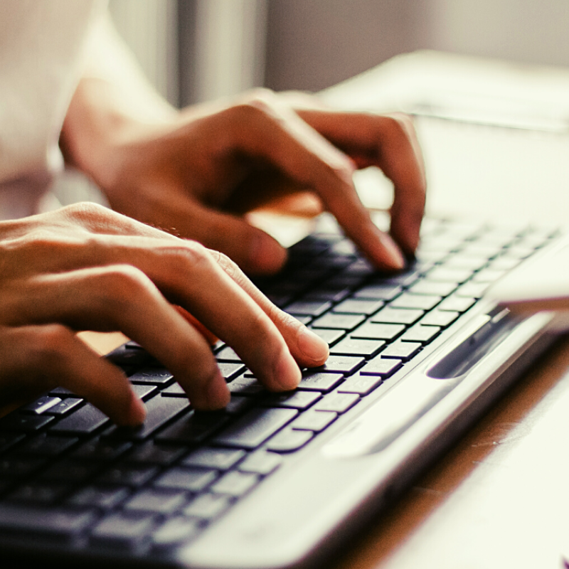 Typing at a keyboard.