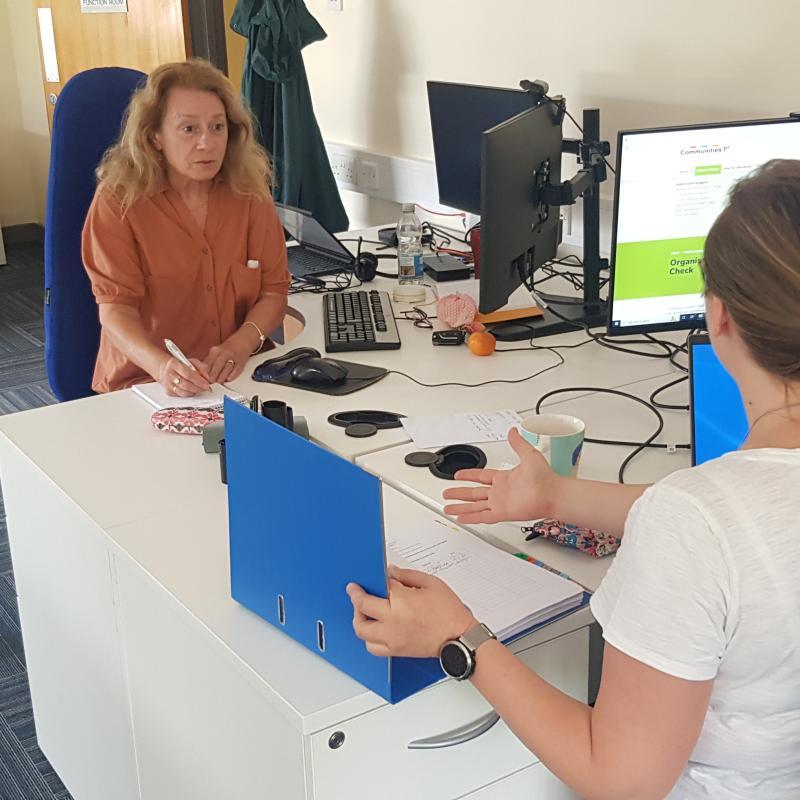 Team member providing funding advice.