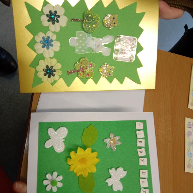 Two DIY books featuring flowers and gold, green and white paper.