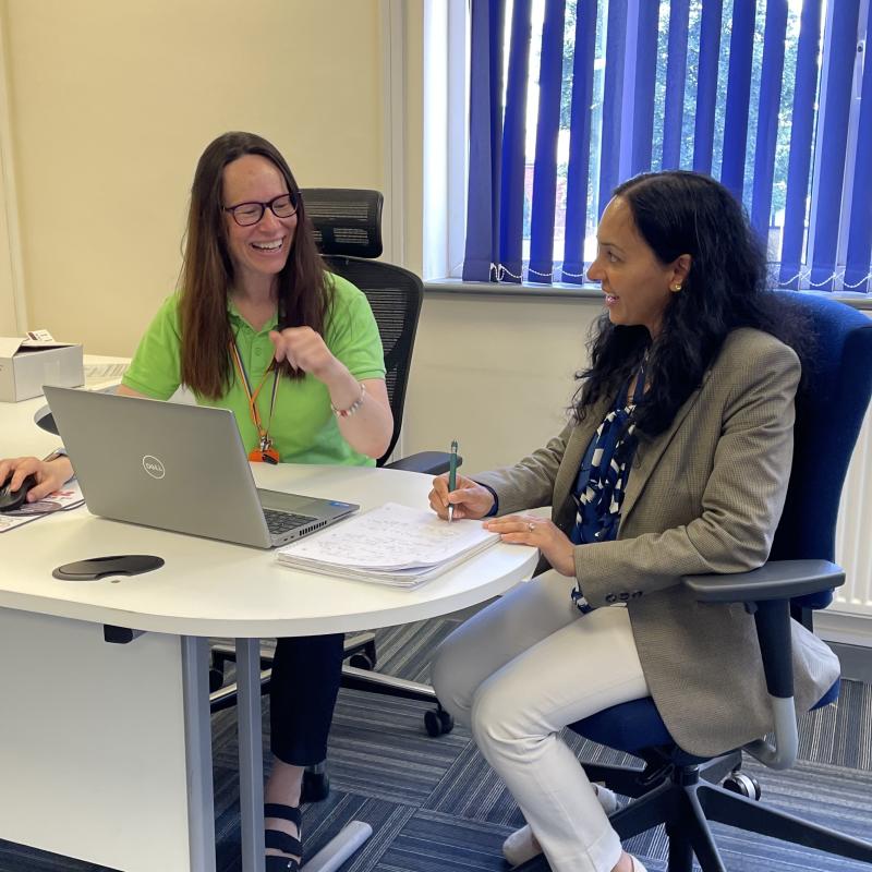 Two members of staff, Jalpa and Judit, collaborating at a desk.