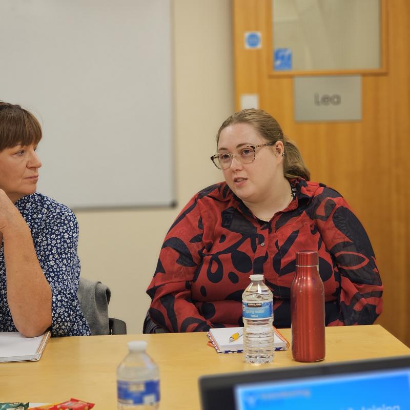A photo taken at a training session featuring two people.