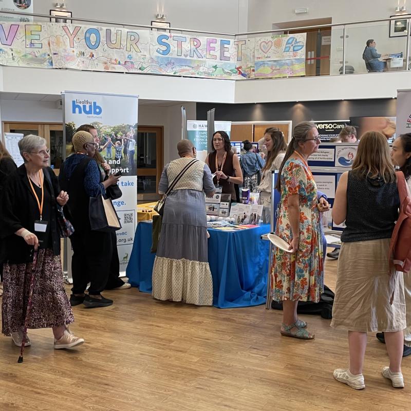 People loking around conference stalls